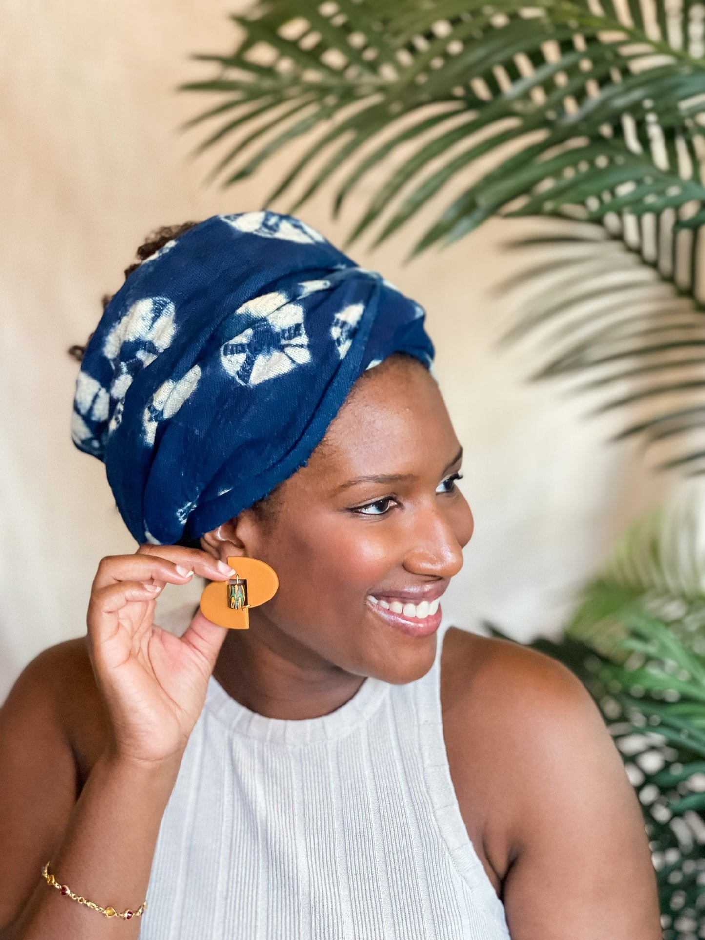 Woman wearing yellow African-Inspired earrings with recycled glass beads Atiwo Designs