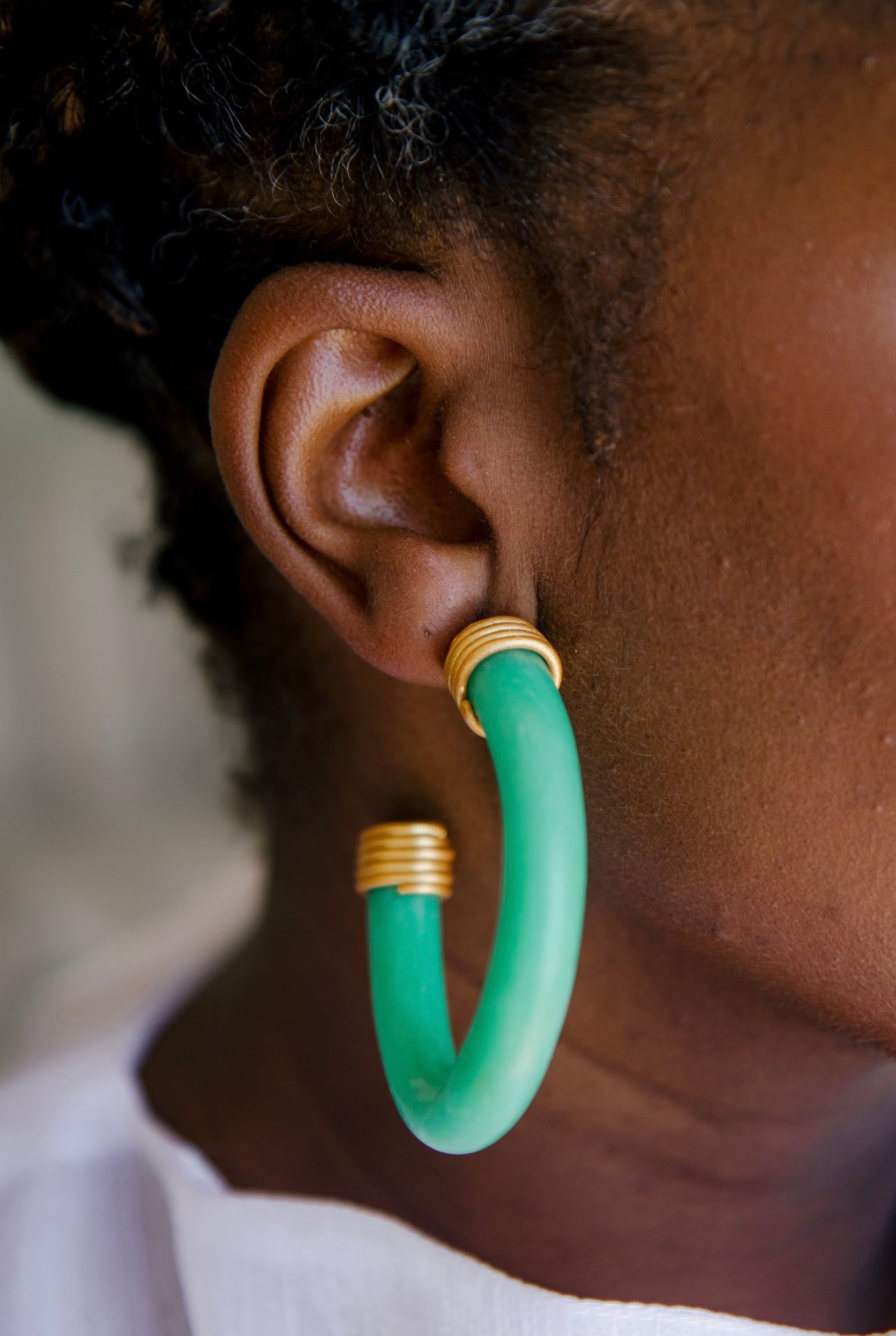 Jade-inspired hoop earrings with gold details Atiwo Designs